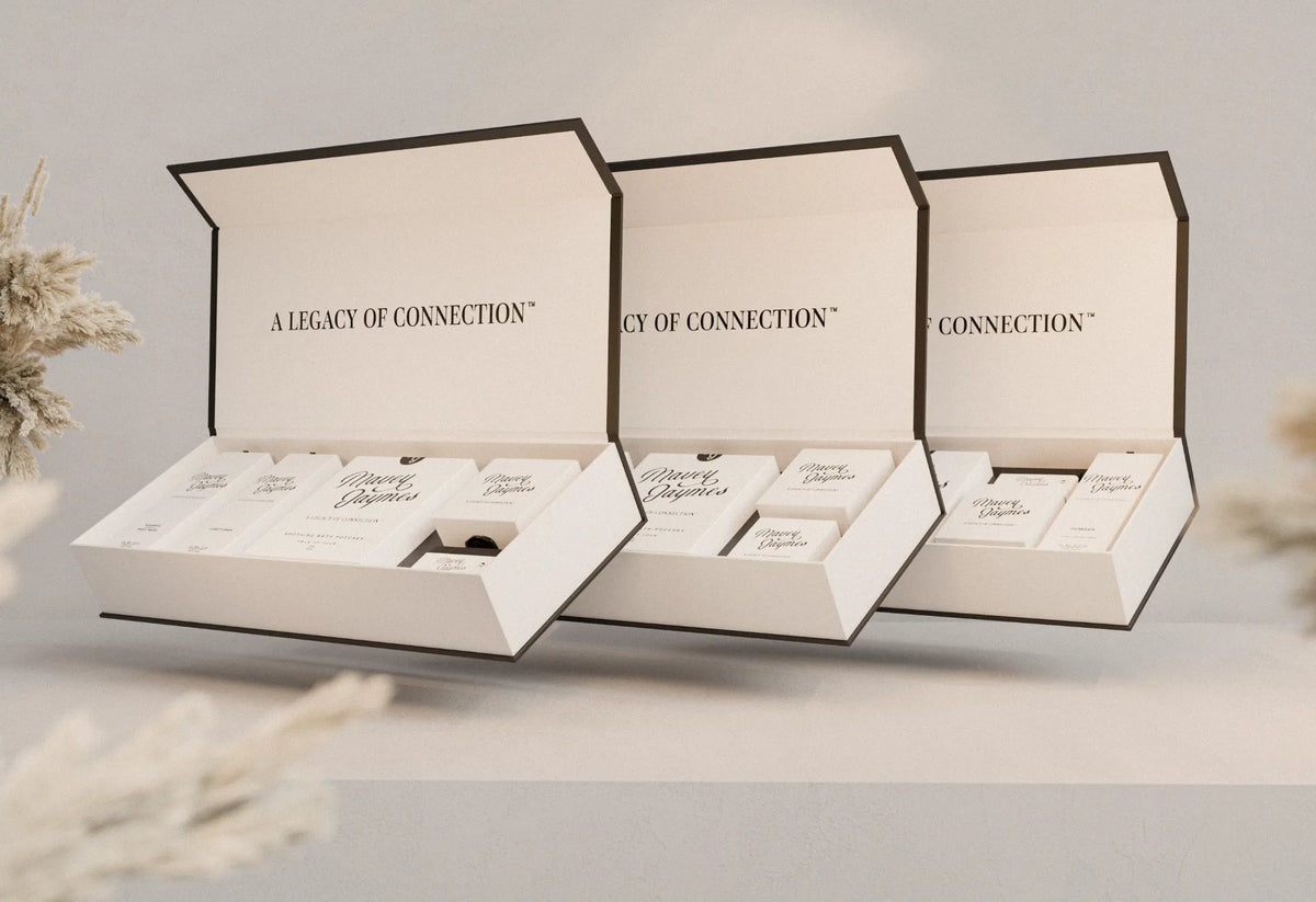 Three open Mavey Jaymes gift collection boxes, each lined with “A legacy of connection”